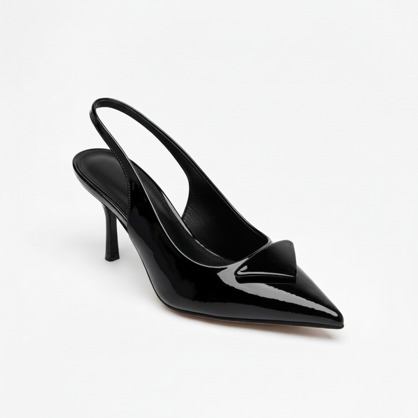 Black patent stiletto slingback shoe on a white studio background